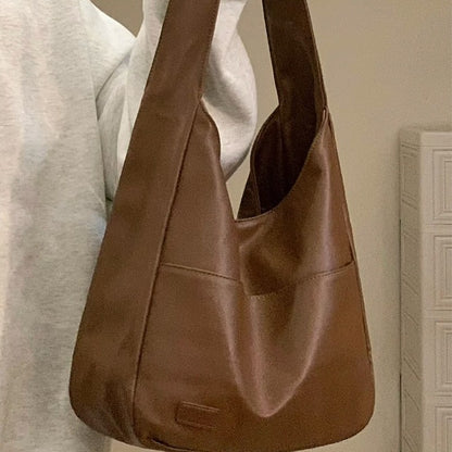 Soft leather tote bag Large capacity brown bucket bag Versatile commuting shoulder bag for women