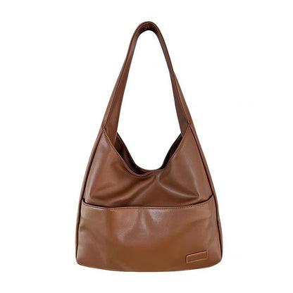 Soft leather tote bag Large capacity brown bucket bag Versatile commuting shoulder bag for women